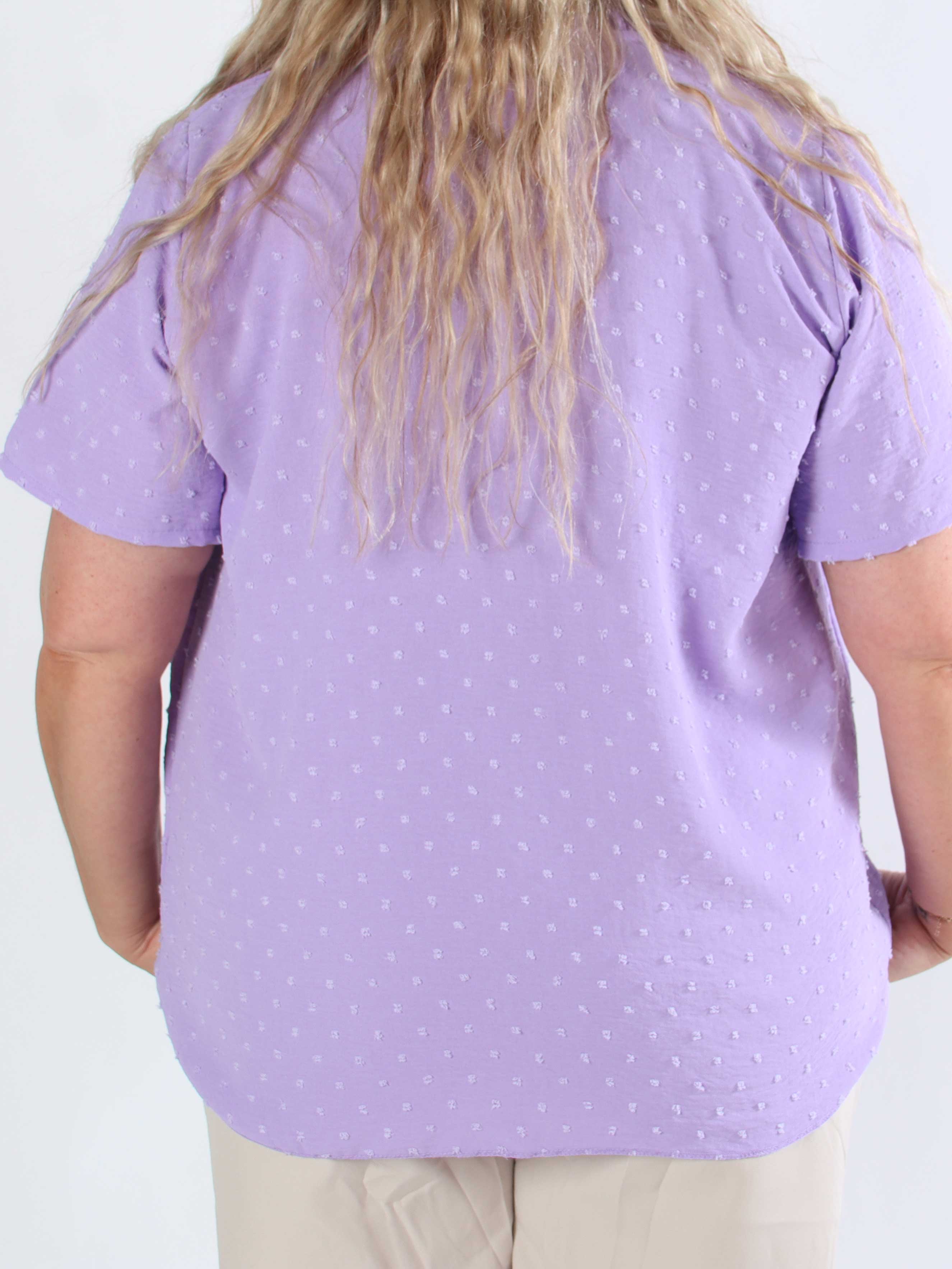 Bloom - Söt tunika i plusstorlek med volangkant och rosett